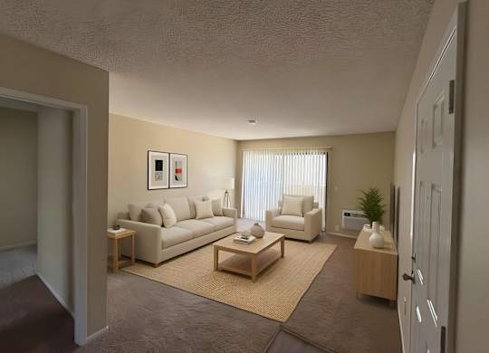 A living room with a couch, armchair, and coffee table.