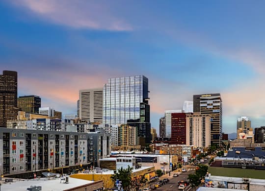 A cityscape with buildings and a clear sky.