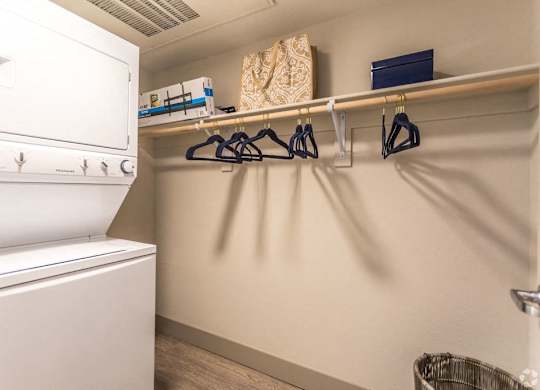 A laundry room with a washing machine and a clothes dryer.