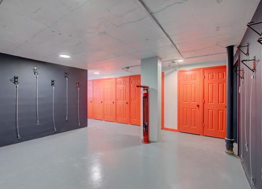 Storage area features bike storage and individual storage rooms.