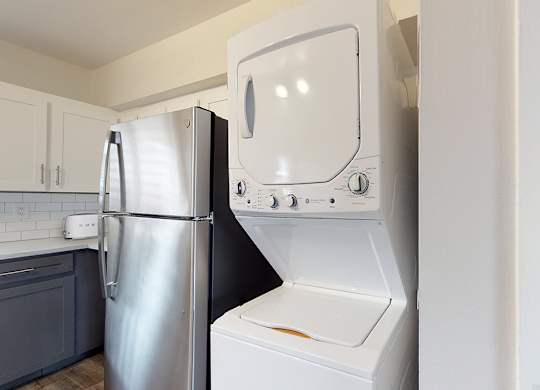 A white oven and refrigerator in a kitchen.