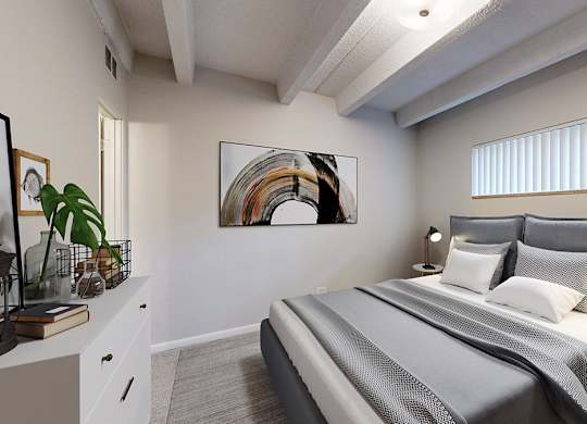 A bedroom with a large bed and a painting on the wall.