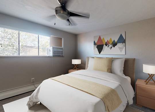 A bedroom with a bed, nightstand, and a ceiling fan.