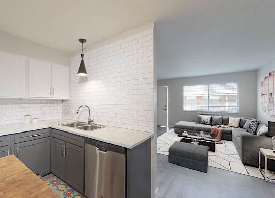 A modern kitchen with a wooden table and a dining area in the background.
