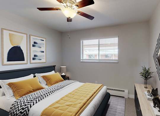 A bedroom with a bed, a mirror, and a ceiling fan.