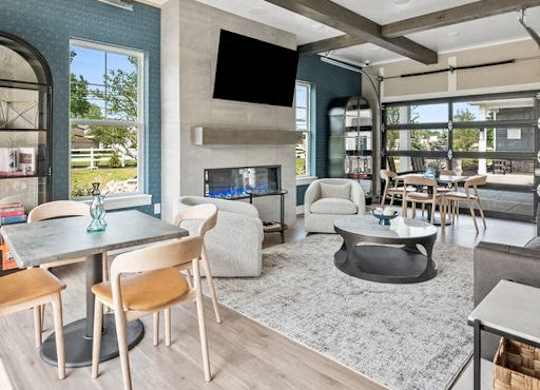 A modern living room with a fireplace and a television.