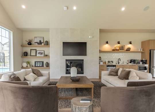 A modern living room with a fireplace and a television at Marcola Apartment Homes, Oregon, 97477