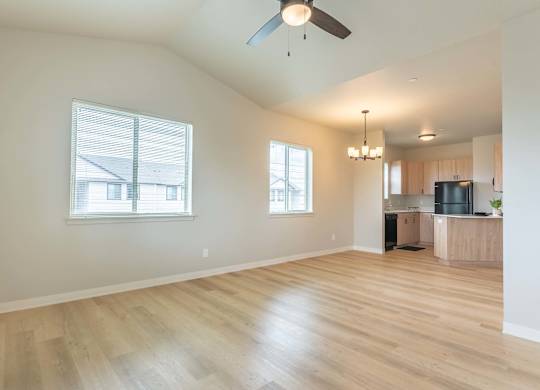 A room with wooden floors and a ceiling fan at Marcola Apartment Homes, Forest Grove, OR, 97477