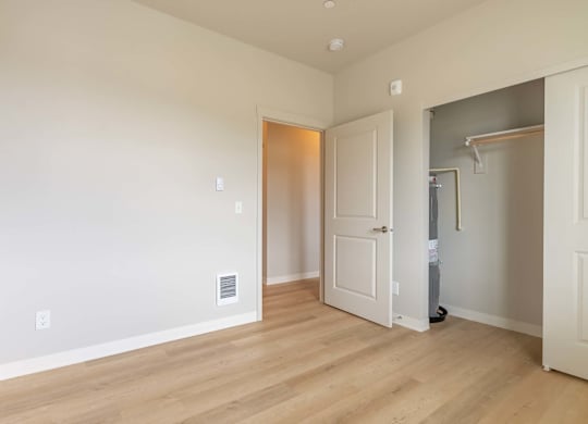A room with a door and a small shelf at Marcola Apartment Homes, Forest Grove, OR, 97477