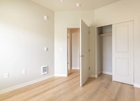 A room with a door open to a hallway at Marcola Apartment Homes, Oregon, 97477