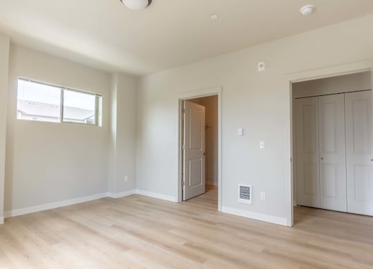 A room with a wooden floor and white walls at Marcola Apartment Homes, Forest Grove, OR, 97477