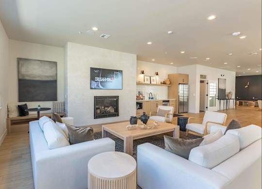 A modern living room with a fireplace and a television at Westgate Apartment Homes, Pendleton, 97801