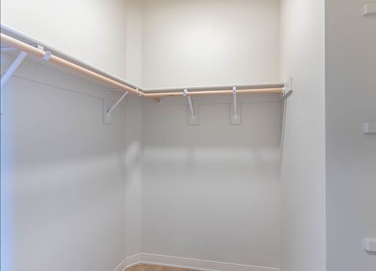A white closet with a shelf and a white door at Westgate Apartment Homes, Pendleton, OR, 97801