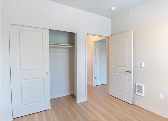 A white door is open to a hallway at Westgate Apartment Homes, Pendleton