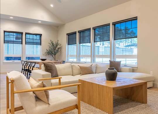 A living room with a white couch and a wooden coffee table at Westgate Apartment Homes, Pendleton, 97801