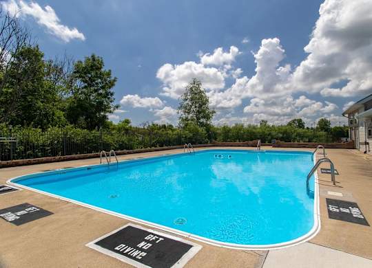 A pool with a sign that says