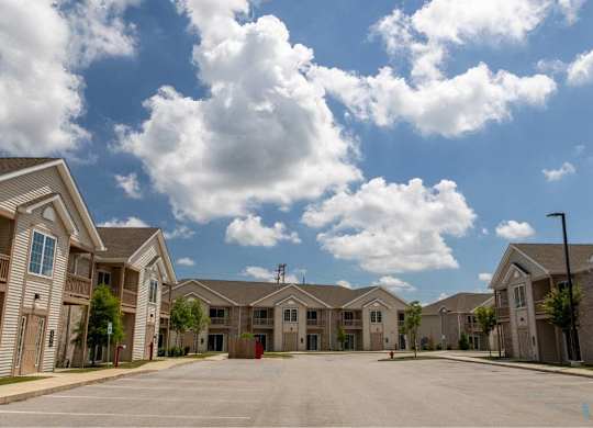A row of houses with a clear blue sky above them.