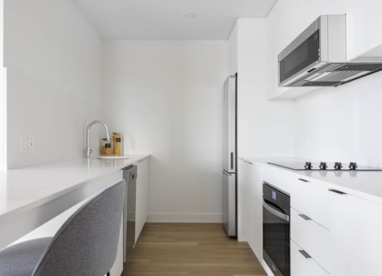Modern Kitchen at Lynk De la Savane Apartments, Québec