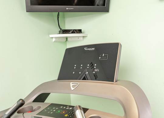 A treadmill with a control panel on top of it at Sawbranch Apartments, South Carolina