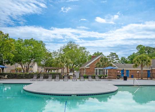A swimming pool with a blue rope in the middle of it at The Preserve at Pine Valley Apartments, Wilmington, NC