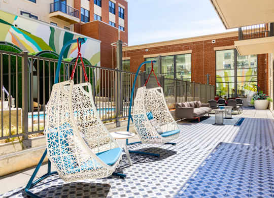 A patio with two chairs and a table.at The Vale at the Parks, Washington, DC  