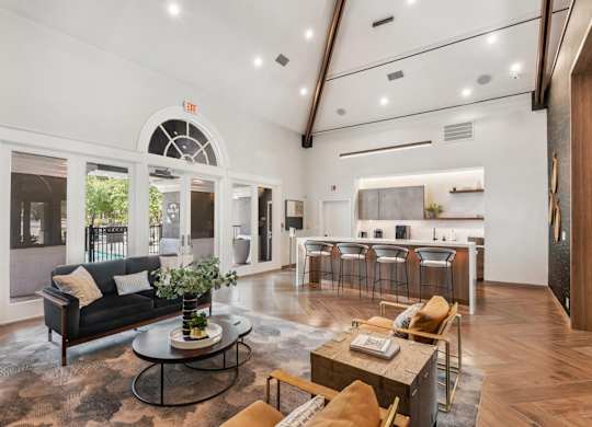 A living room with a black couch and a coffee table.at Onyx183, Austin Texas  