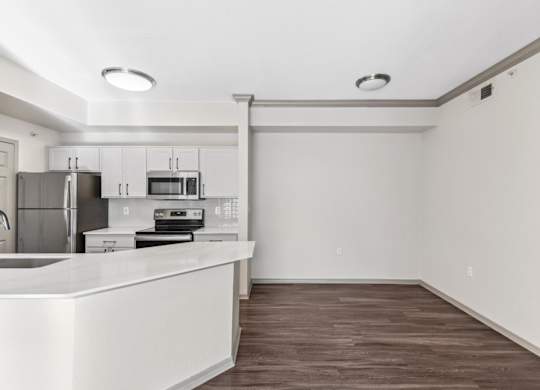 A kitchen with white countertops and stainless steel appliances.at Onyx183, Texas  