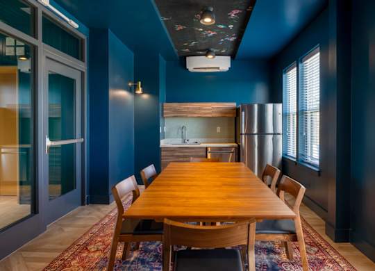 A dining room with a wooden table and chairs.at The Vale at the Parks, District of Columbia  