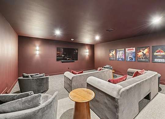 Room with grey couch and tv at 701 Hudson, Los Angeles, CA
