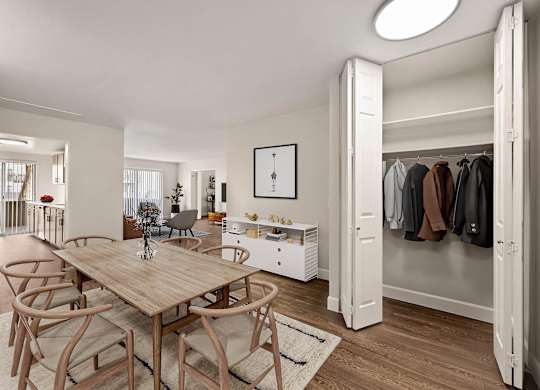 A room with a table and chairs and a wardrobe. at The Lex At Lowry, Denver, CO, 80224