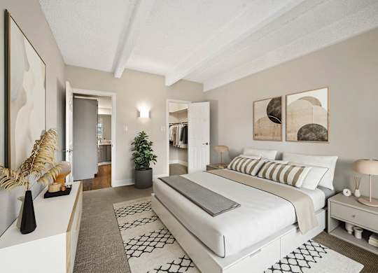 A bedroom with a large bed and a painting on the wall. at The Lex At Lowry, Denver, 80224