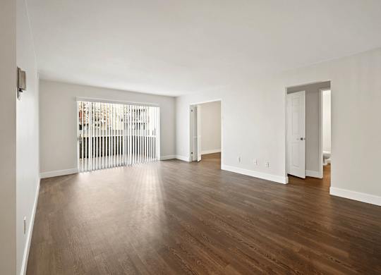 A room with wooden floors and white walls. at The Lex At Lowry, Colorado, 80224