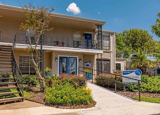A building with a blue door and a sign that says