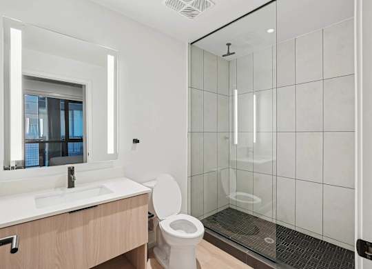 Bathroom with sink and mirror at Velaris Living Apartments, Denver