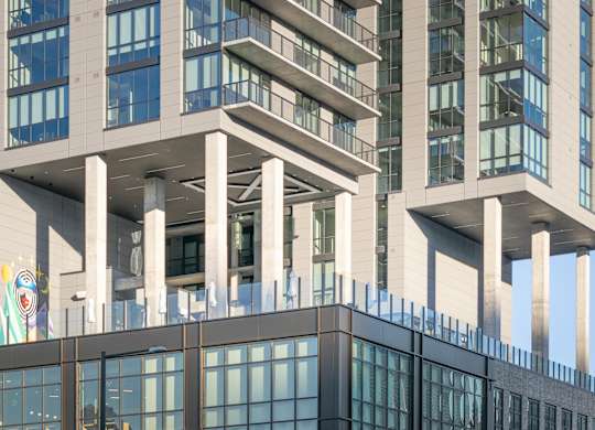 Modern building with a glass facade at Velaris Living Apartments, Denver, Colorado