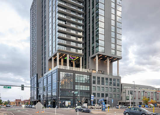 Modern glass building at Velaris Living Apartments, Colorado