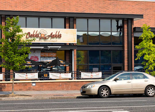 A car is parked in front of a restaurant.at The Vale at the Parks, Washington  