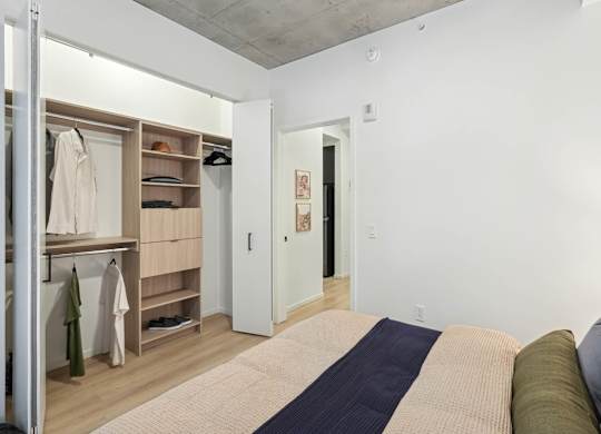 Bedroom with closet at Velaris Living Apartments, Denver, CO, 80205