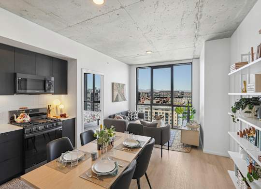 Living room with oversized windows at Velaris Living Apartments, Colorado