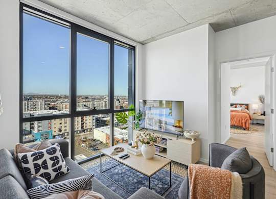 Living room with TV at Velaris Living Apartments, Denver