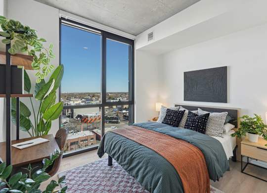 Bedroom with a comfortable bed at Velaris Living Apartments, Colorado, 80205