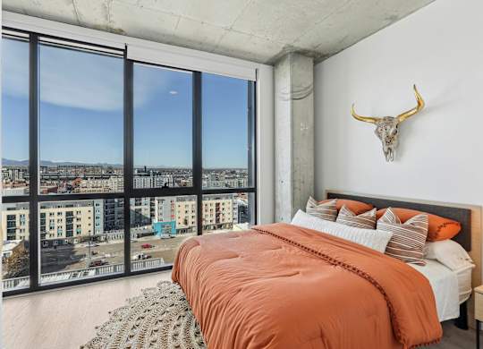 Bedroom with cozy bed at Velaris Living Apartments, Denver