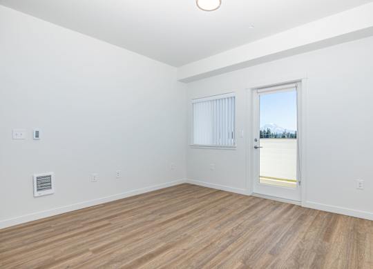 A room with a window and a door.