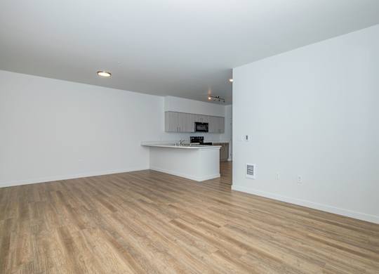 A room with wooden floors and white walls.