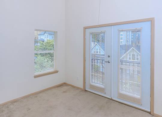 A room with a window and a door.
