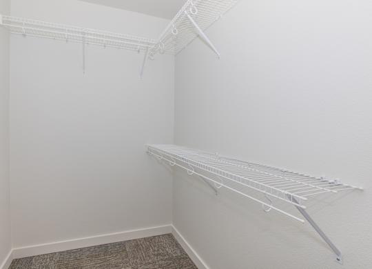 Empty white shelving unit in a room.