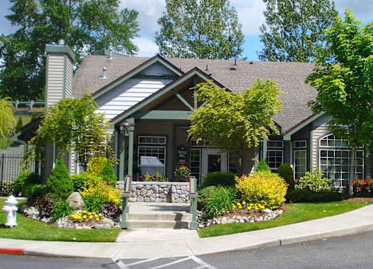 A house with a front yard and a fire hydrant.