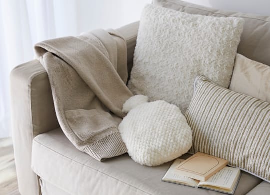 A room with a window and a mat on the floor.
