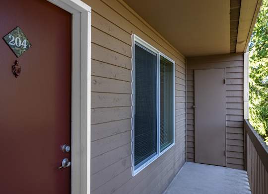 A red door with a number 204 on it.