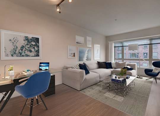 A modern living room with a blue chair and a white couch.